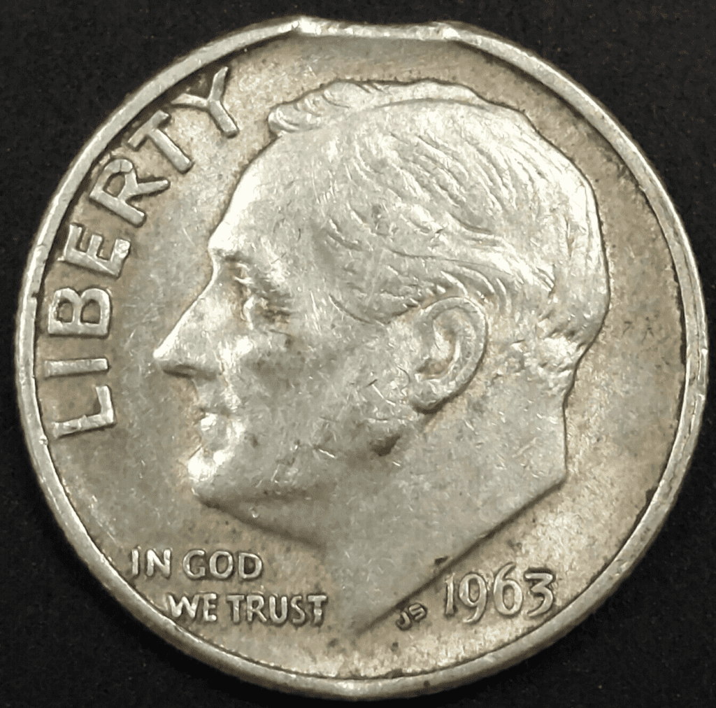 1963年的一枚硬币，上面有一个剪掉的小板